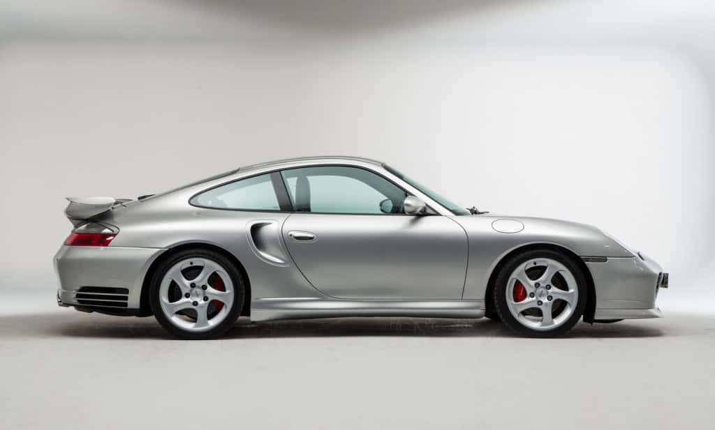 Caption: Refined Elegance - Porsche 996 On The Street Wallpaper