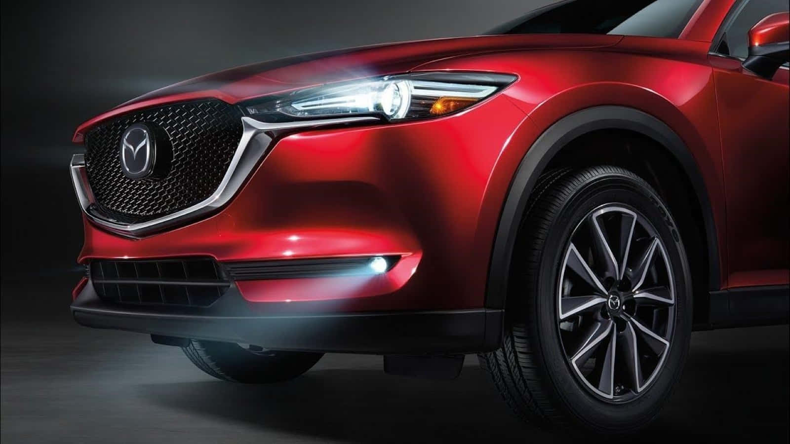 Caption: Sleek And Captivating Mazda Cx-30 On The Road Wallpaper