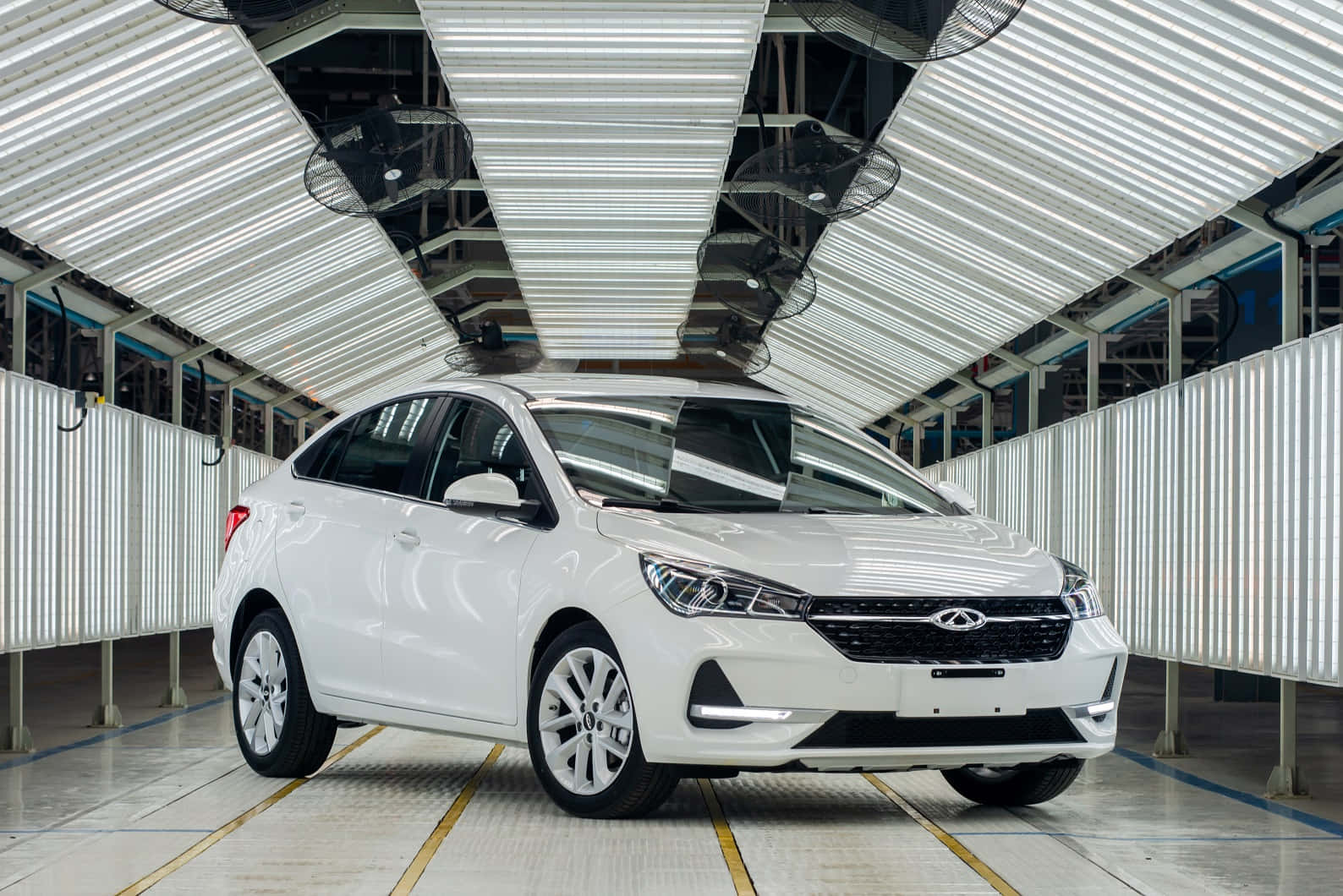 Caption: Sleek And Elegant – The Chery Arrizo 5 In Action On The Open Road Wallpaper