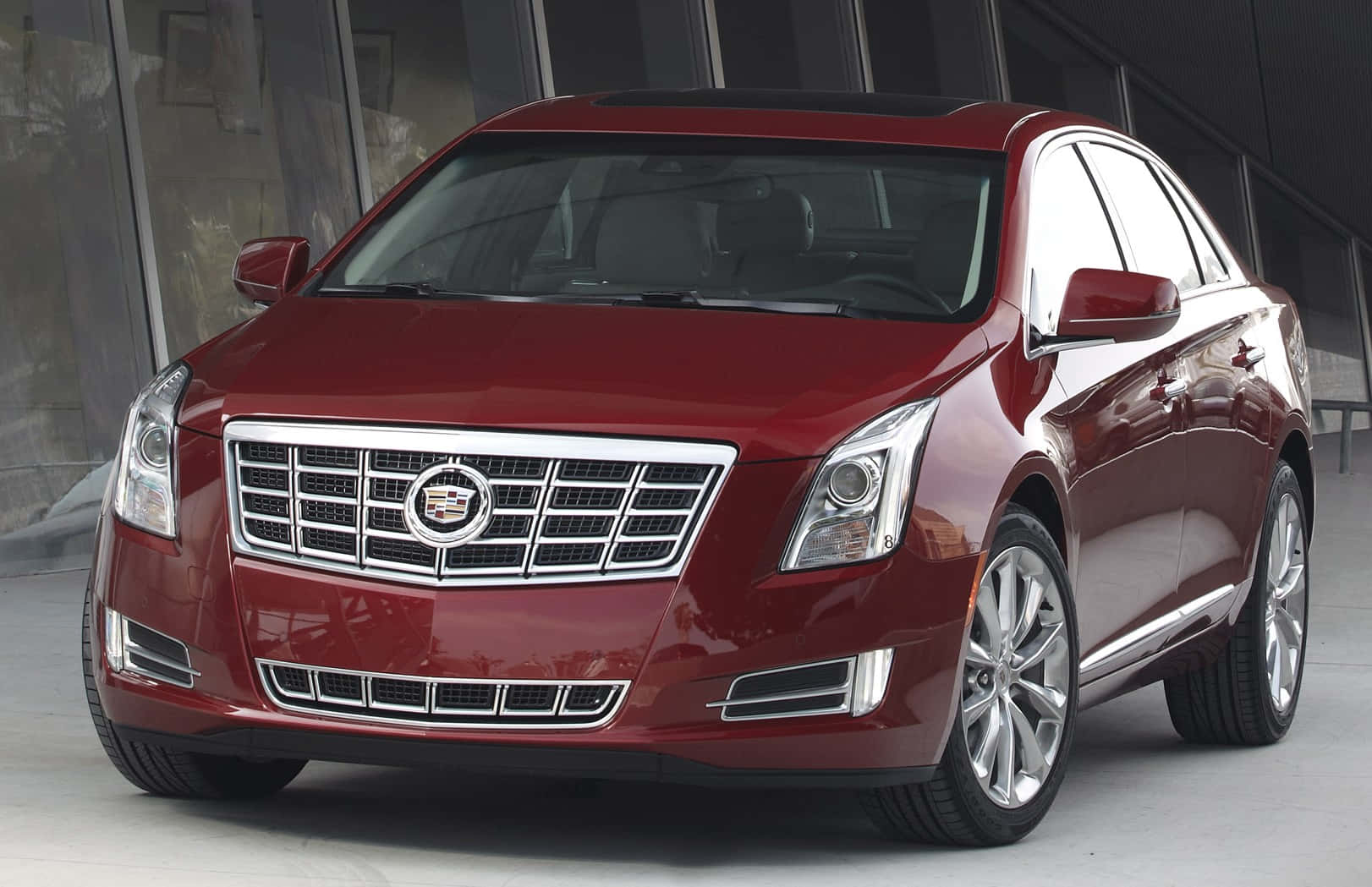 Caption: Sleek And Powerful Cadillac Xts In Motion Wallpaper