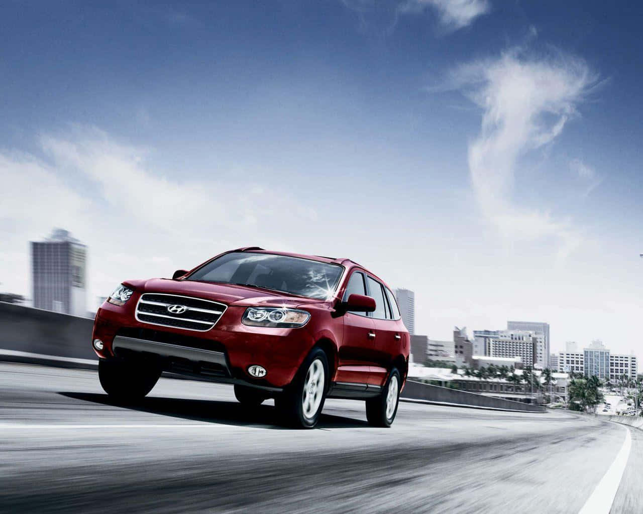 Caption: Sleek And Stylish Hyundai Santa Fe On A Scenic Drive Wallpaper