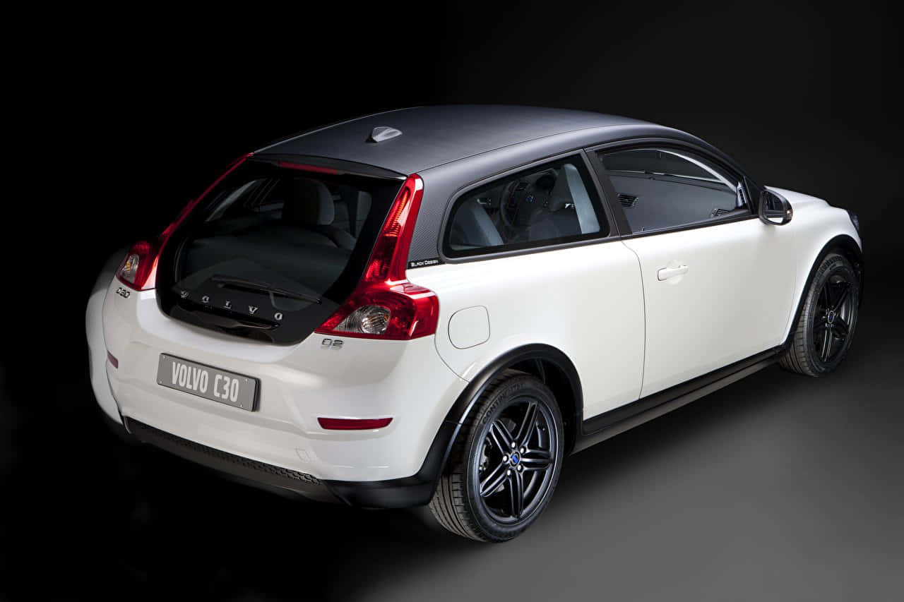 Caption: Sleek And Stylish Volvo C30 In The City Wallpaper