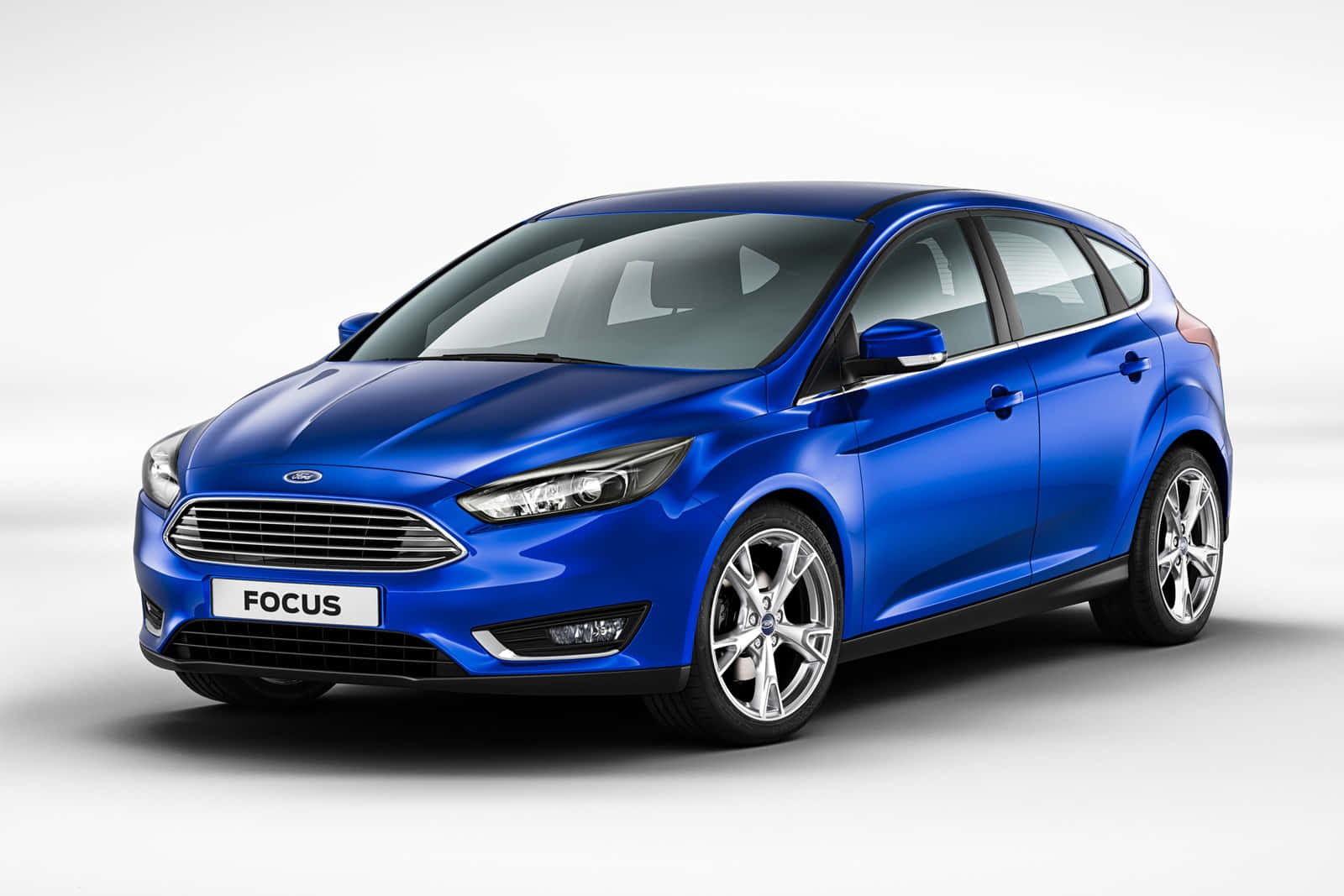 Caption: Sleek Ford Focus Cruising On The Road Wallpaper