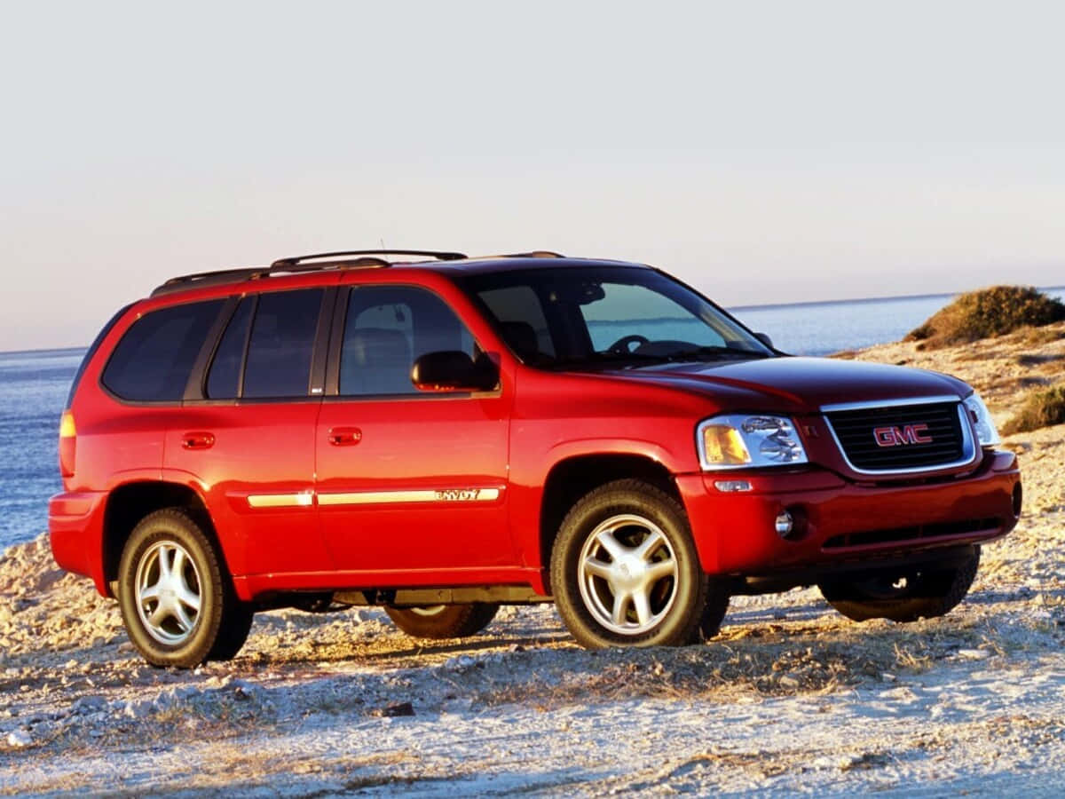 Caption: Sleek Gmc Envoy In The Wild Wallpaper