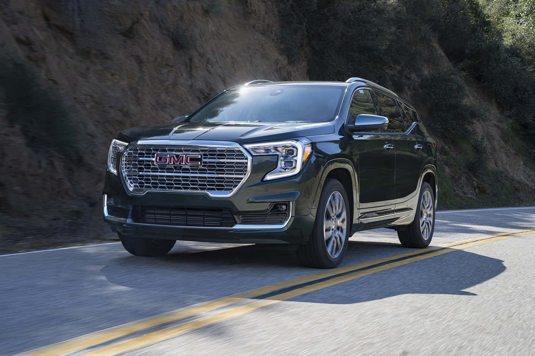 Caption: Sleek Gmc Terrain Cruising The Open Road Wallpaper