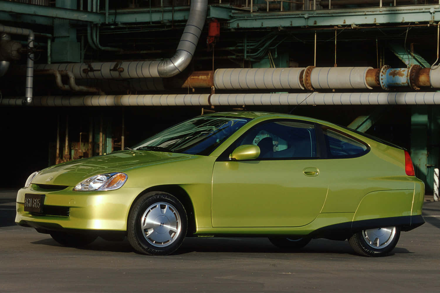 Caption: Sleek Honda Insight On The Move Wallpaper