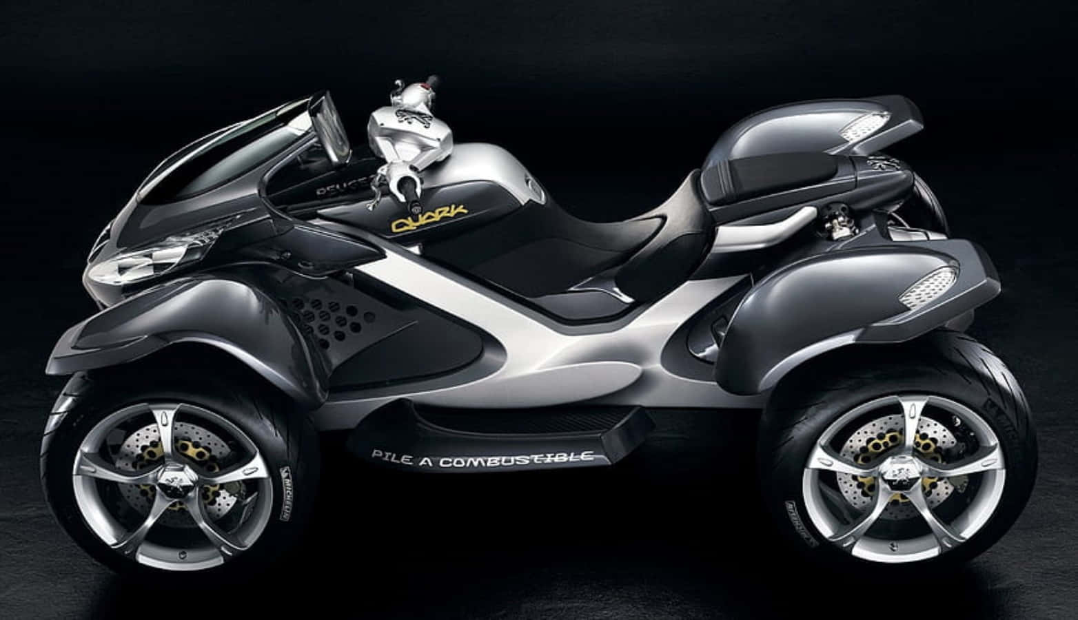 Caption: Sleek Peugeot Motorcycle On The Open Road Wallpaper