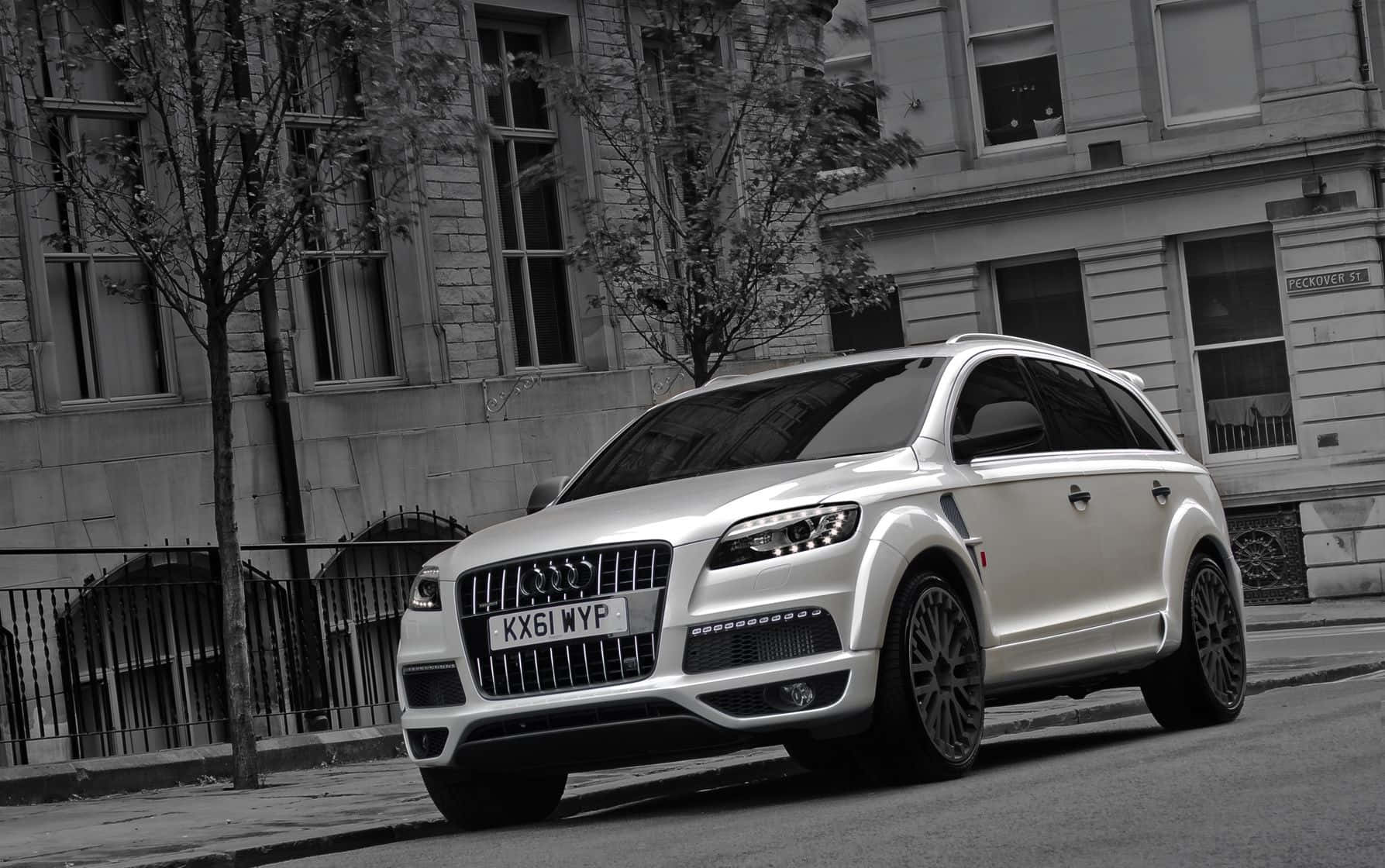 Caption: Sleek White Audi Q7 On The Road Wallpaper