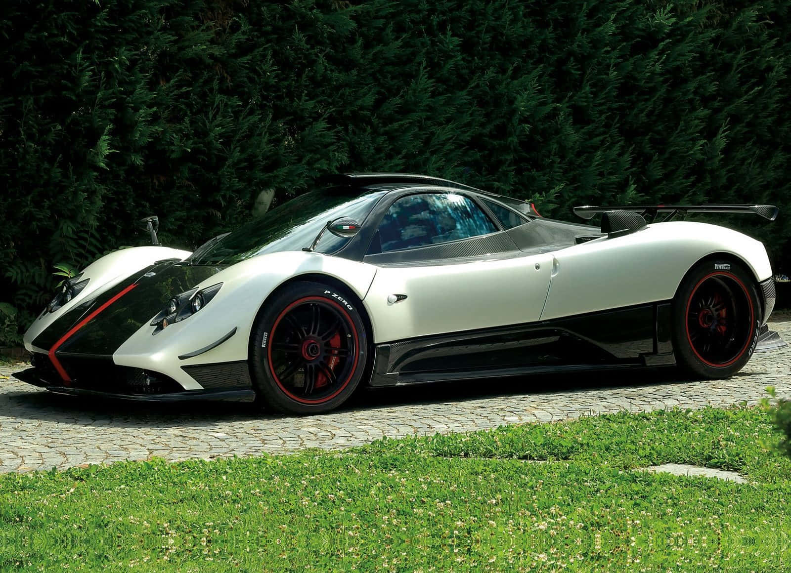 Caption: Stunning Pagani Zonda Cinque Cruising The Streets Wallpaper