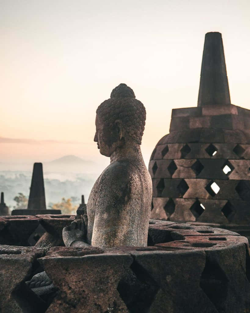 Caption: Stunning Sunrise Over Majestic Borobudur Temple Wallpaper