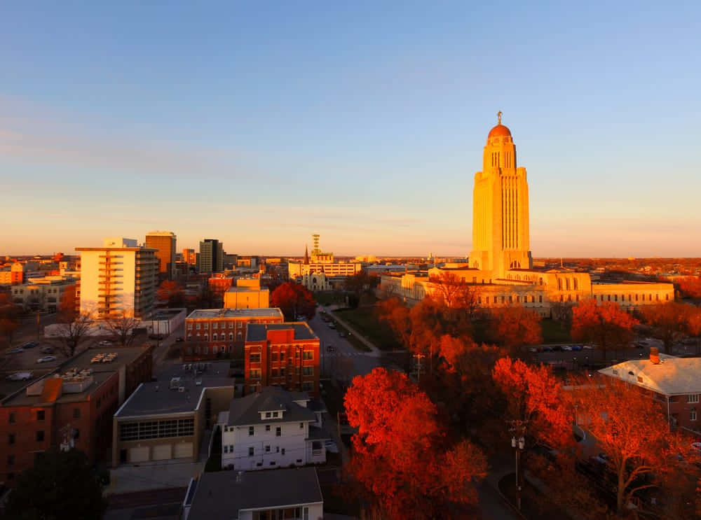 Caption: Stunning Sunset Over Lincoln Skyline Wallpaper