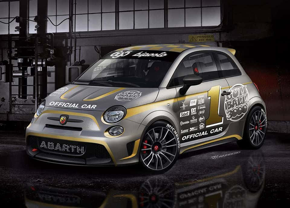 Caption: Stylish And Speedy Abarth 695 On The Road Wallpaper