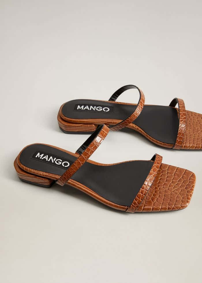 Caption: Stylish Summer Sandals On The Beach Wallpaper