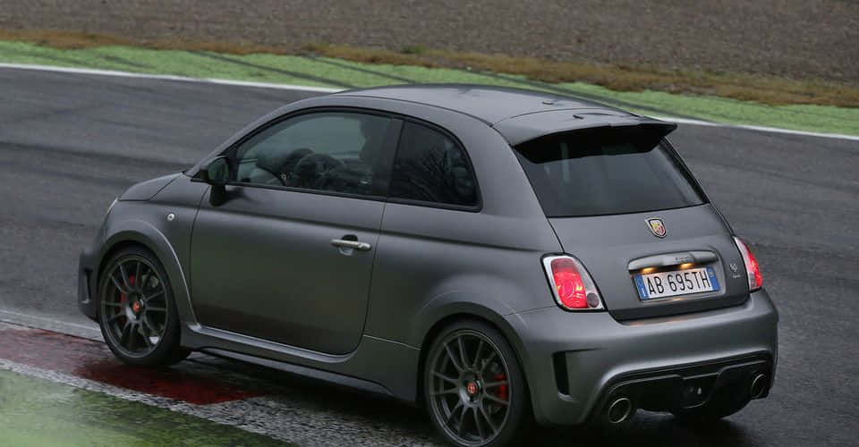 Caption: The Sleek And Sporty Abarth 695 Wallpaper