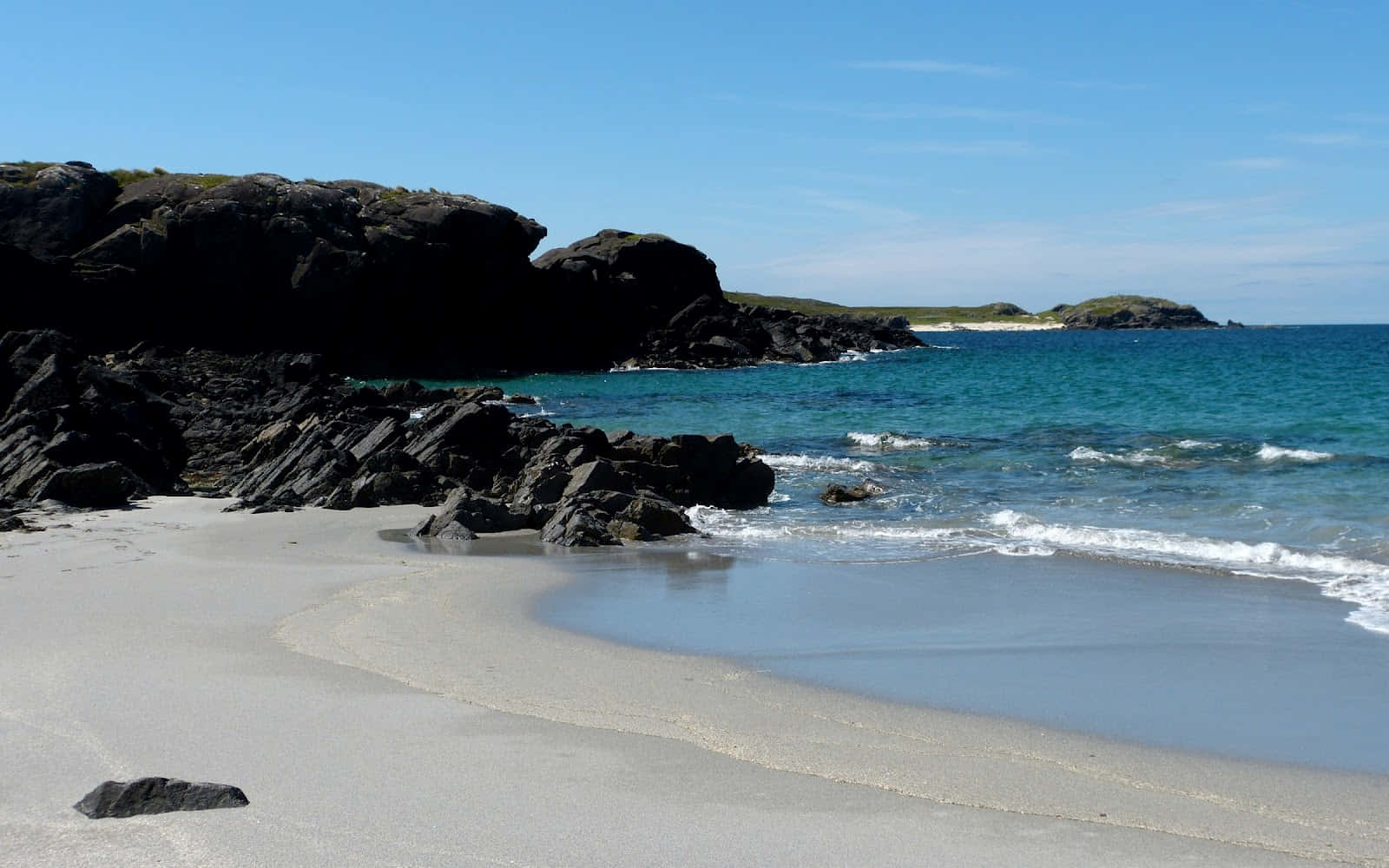 Caption: Tranquil Beach Sand With Sea Shells Wallpaper