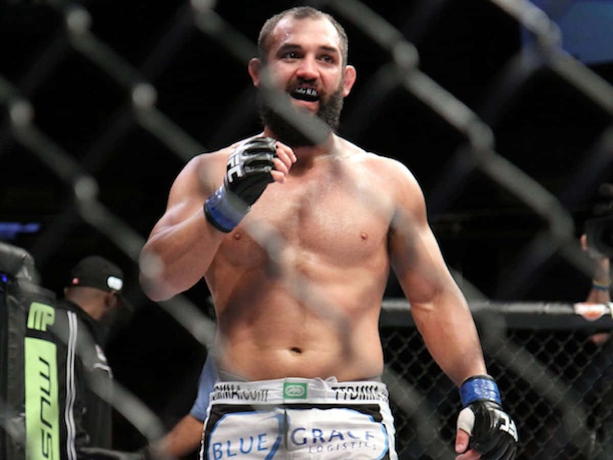 Caption: Ufc Fighter Johny Hendricks Showcasing His Spirit During A Fight Wallpaper