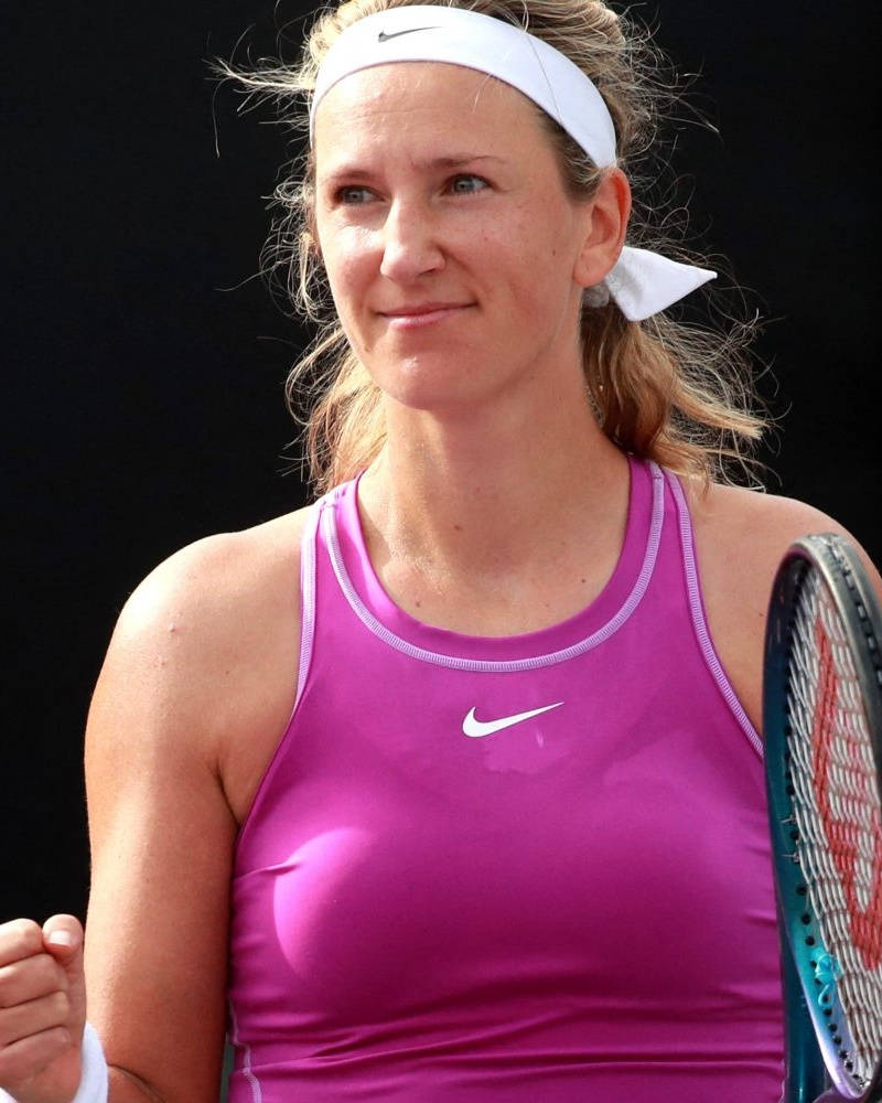 Caption: Victoria Azarenka: The Tennis Maestro In Purple Wallpaper