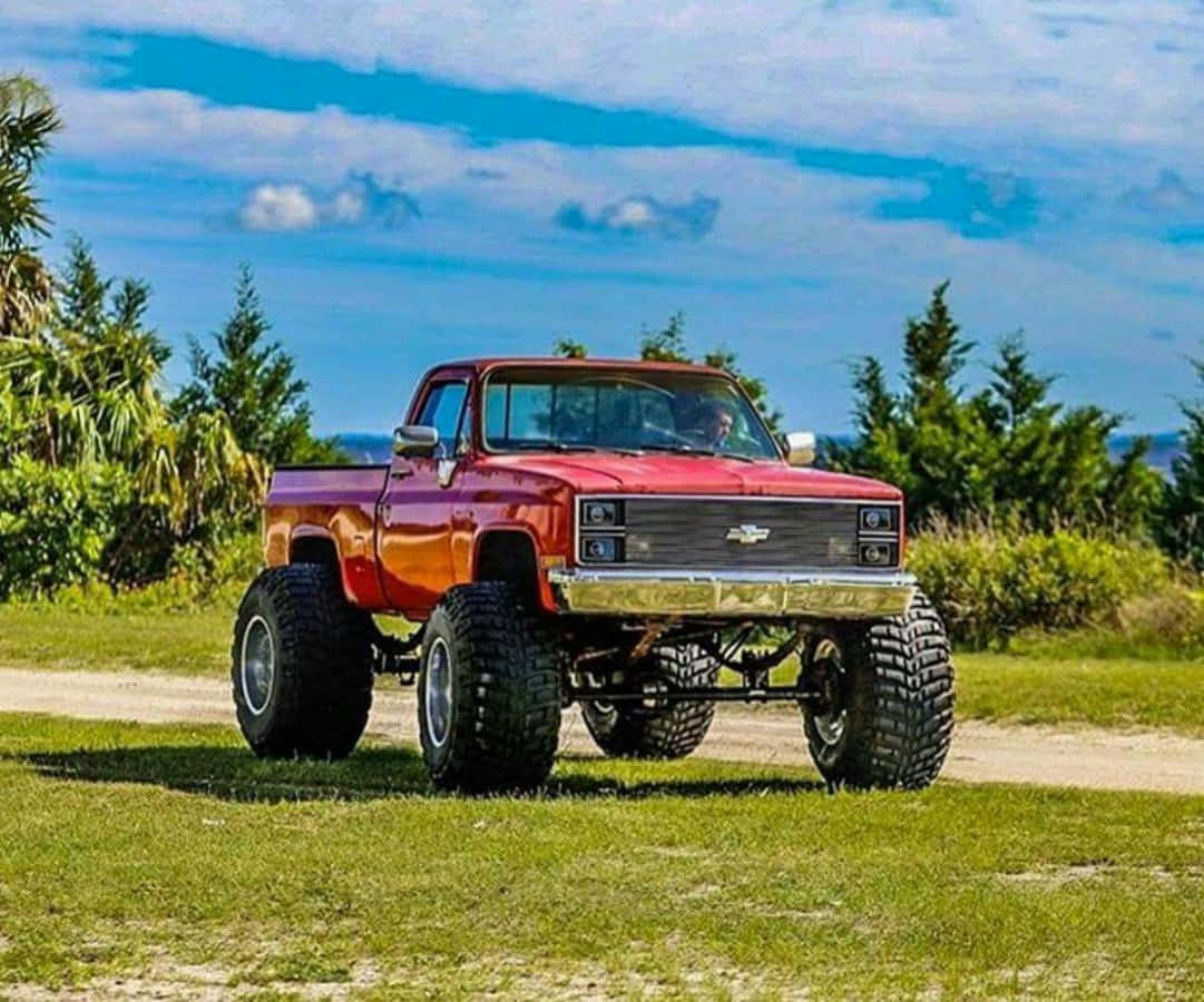 Caption: Vintage Charm: Iconic Square Body Truck Wallpaper