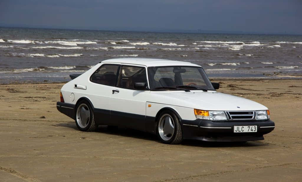 Caption: Vintage Saab 900 In Pristine Condition Wallpaper