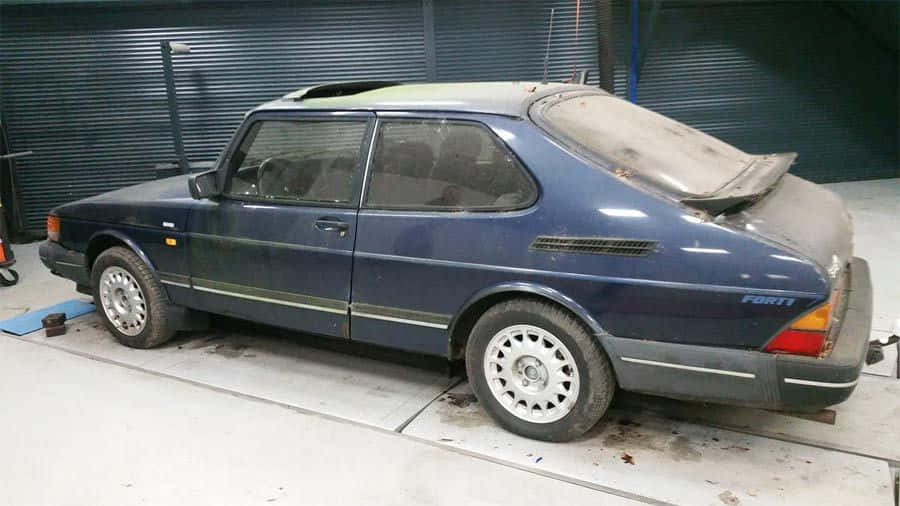 Caption: Vintage Saab 900 In Pristine Condition Wallpaper