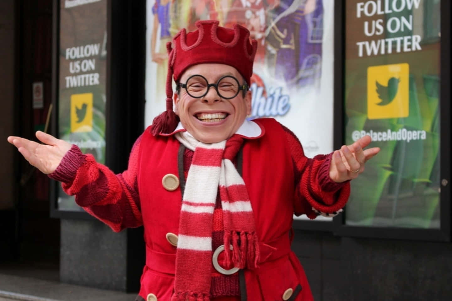 Caption: Warwick Davis Posing For A Photoshoot Wallpaper