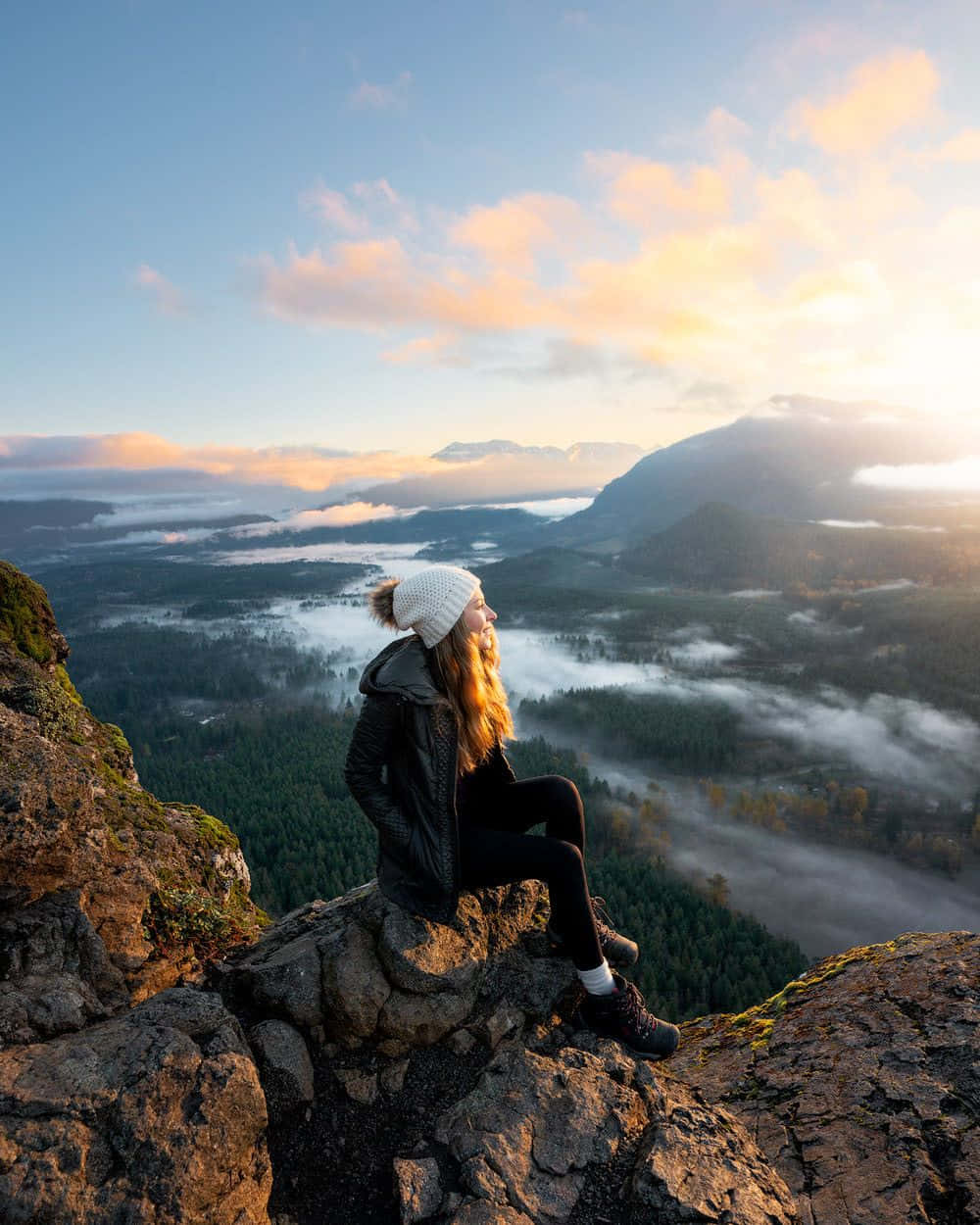 Caption: Winter Hiking Adventure In The Snowy Mountains Wallpaper