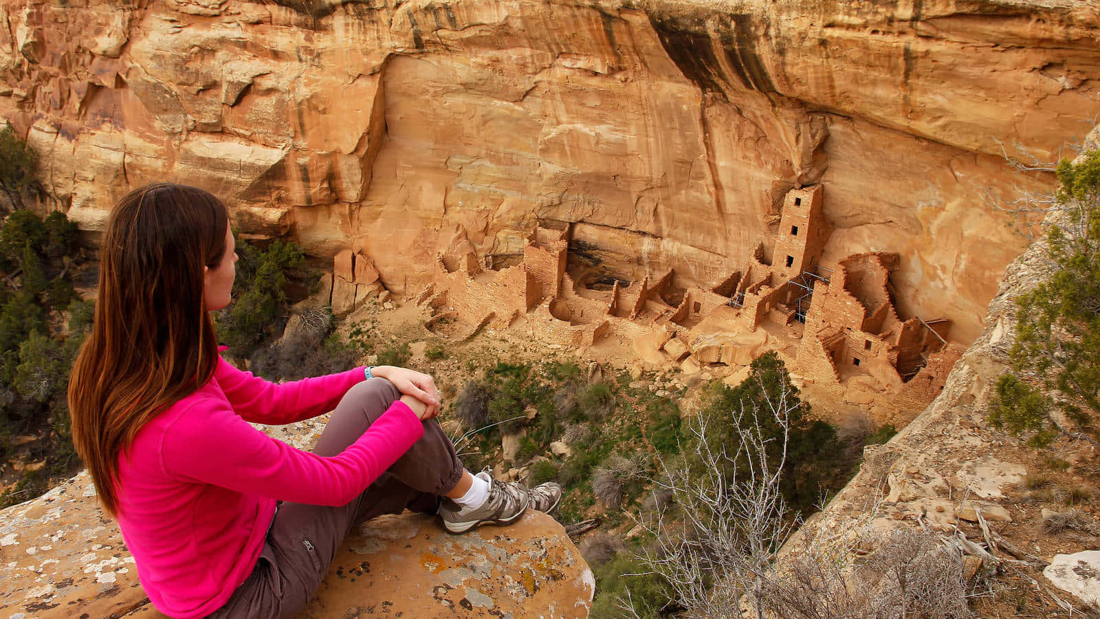 Caption: Woman Embracing Solitude At Mesa Verde National Park Wallpaper