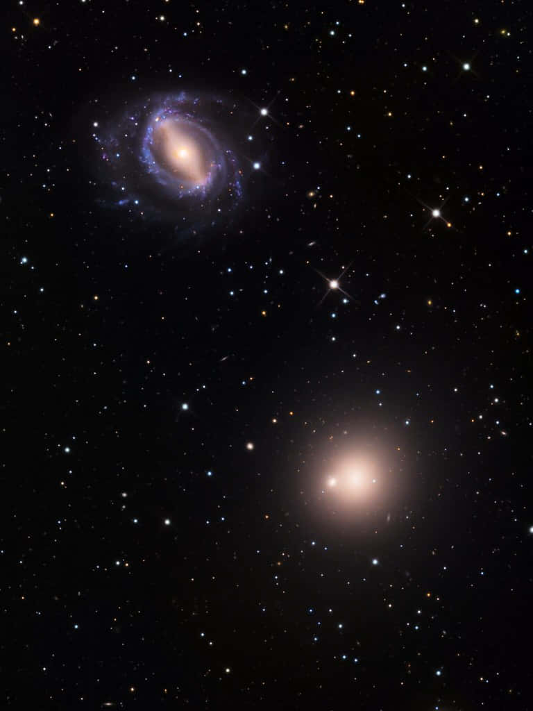 Captivating View Of An Elliptical Galaxy Wallpaper