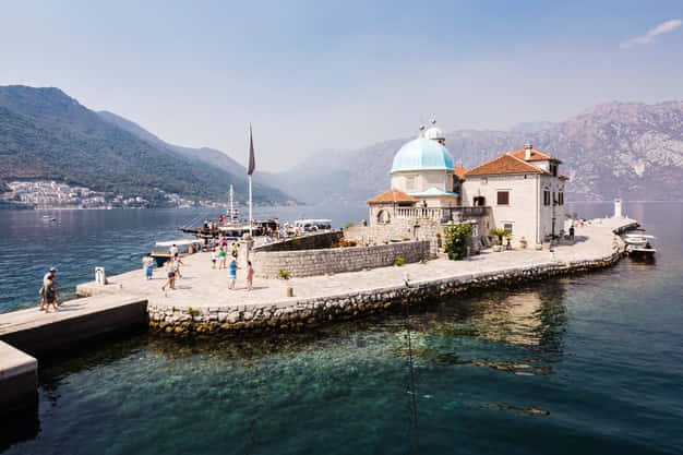 Captivating View Of Our Lady Of The Rocks Church Wallpaper