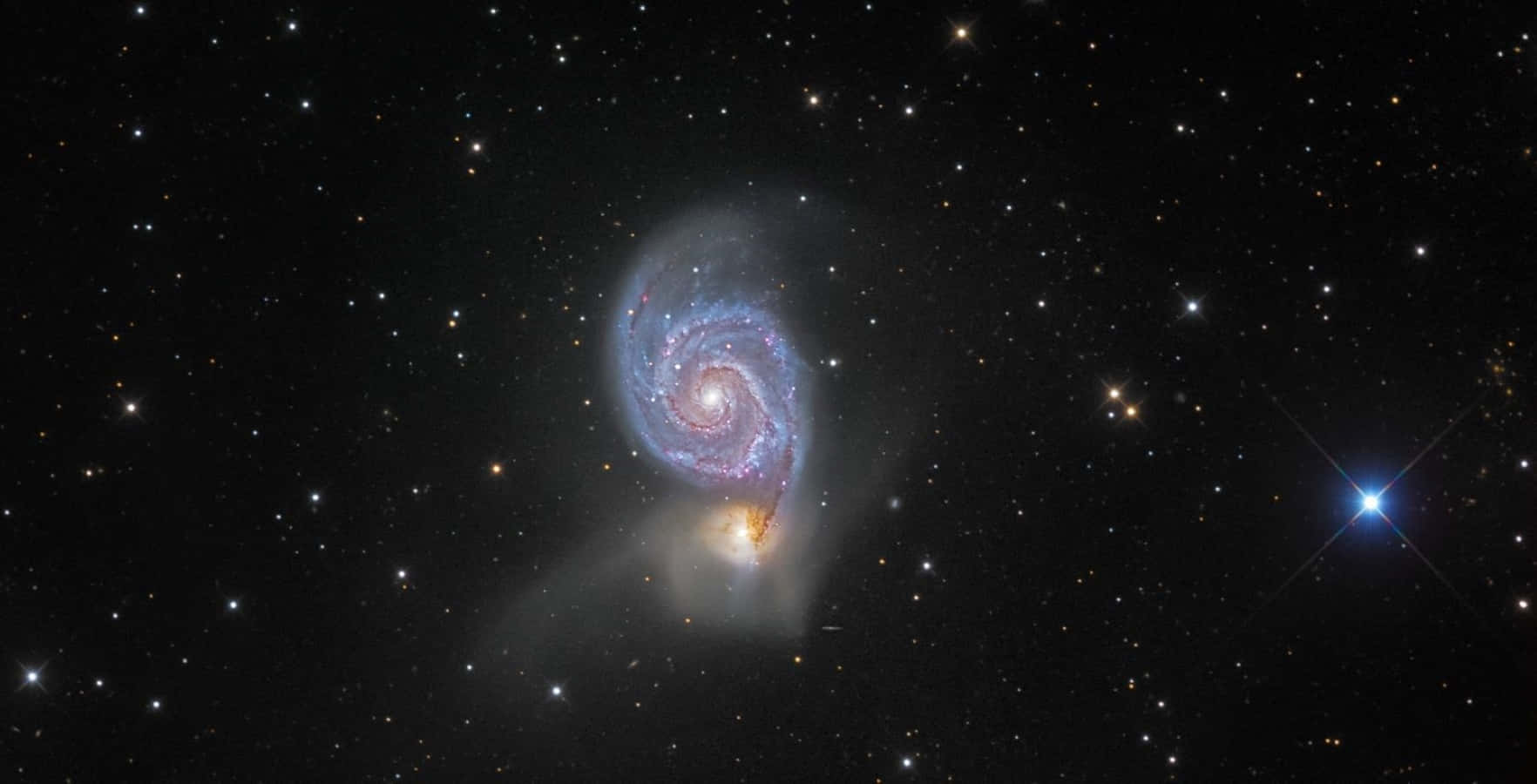 Captivating View Of The Whirlpool Galaxy Wallpaper