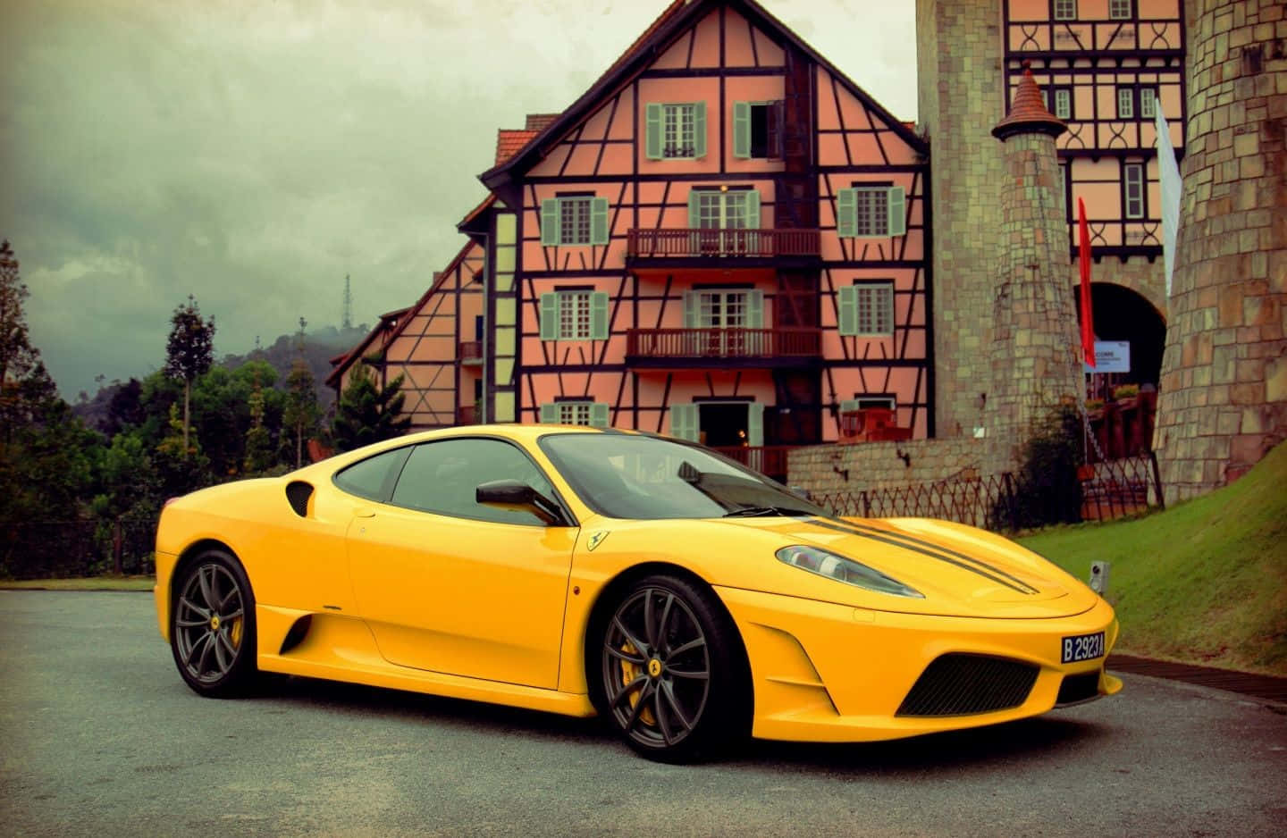 Captivating Yellow Car On The Road Wallpaper