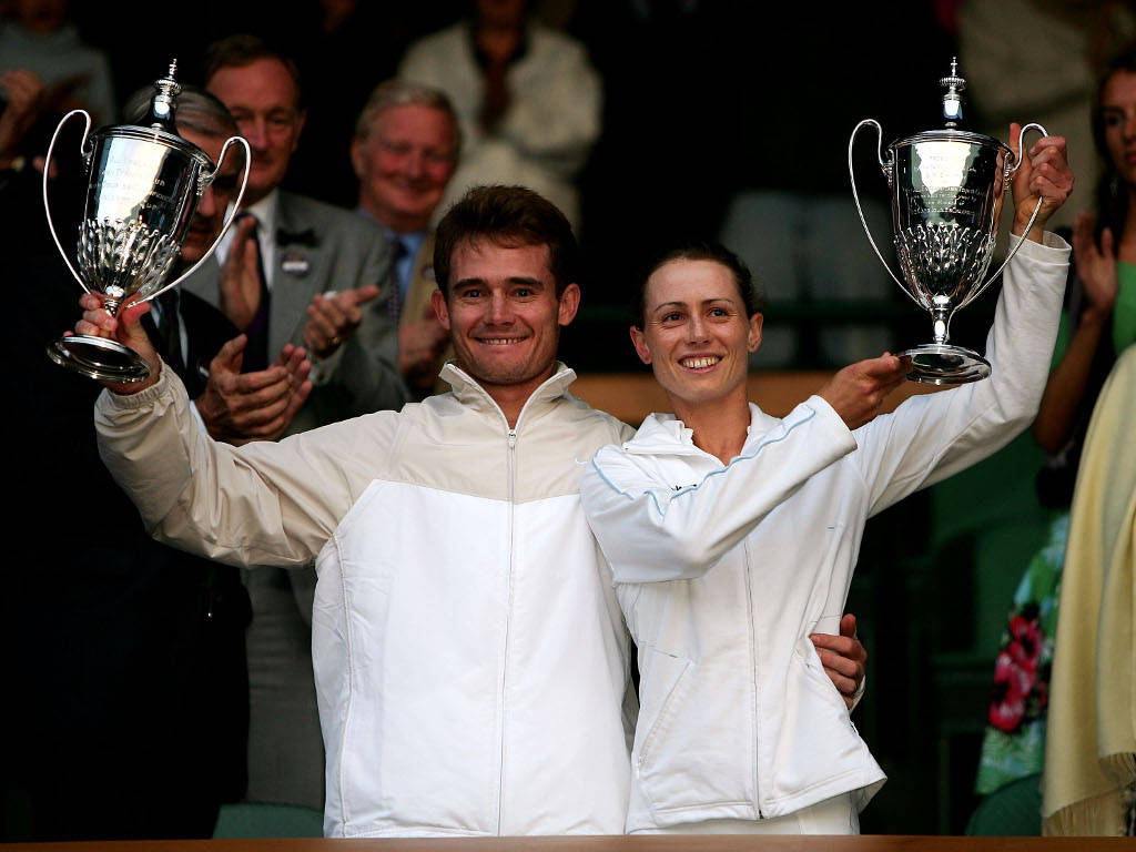 Cara Black And Wayne Black In Action On The Tennis Court Wallpaper