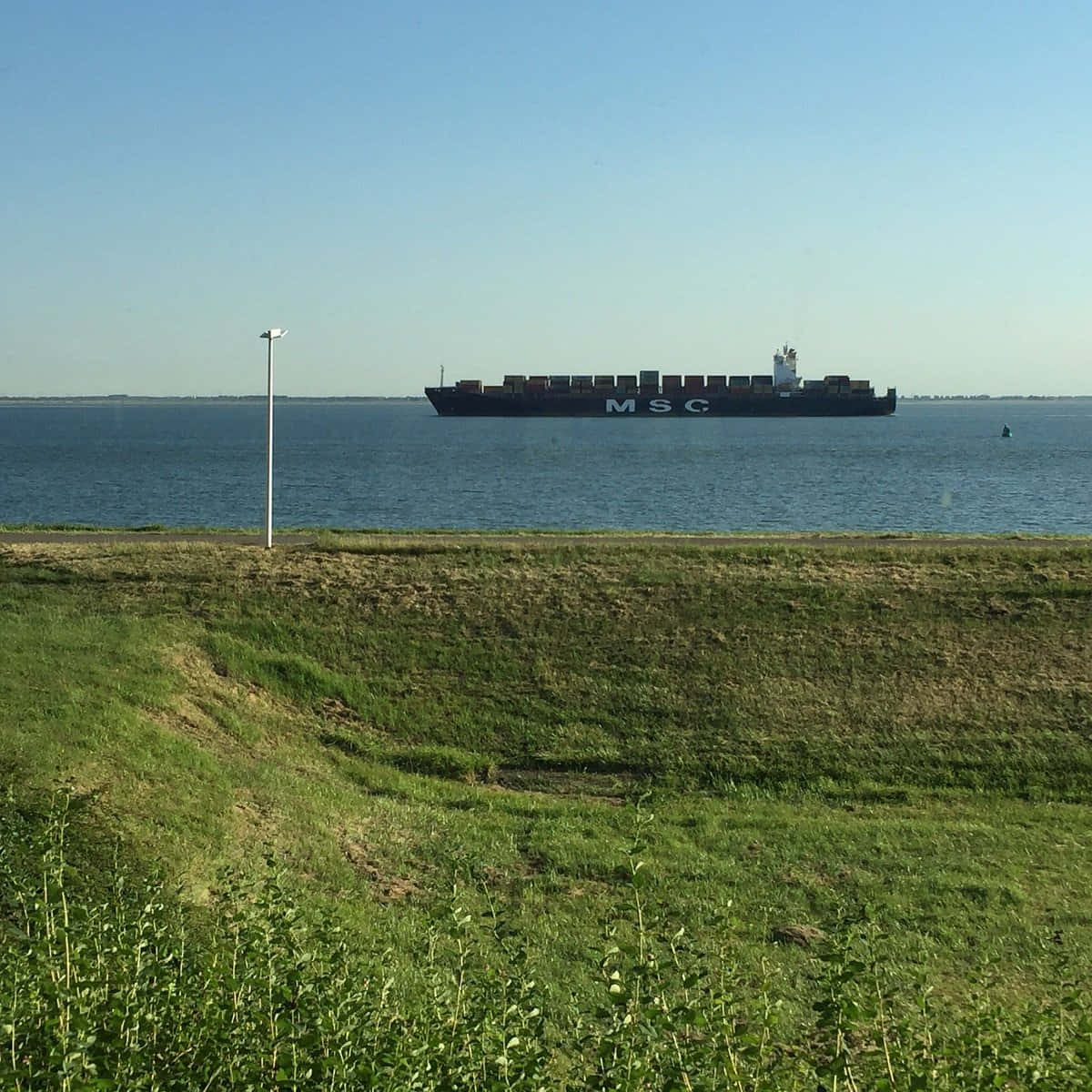 Cargo Ship Passing Terneuzen Waterway Wallpaper