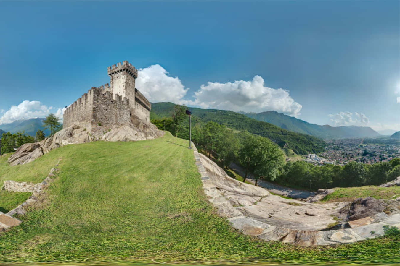 Castle Overlooking The Swiss City Of Bellinzona Wallpaper