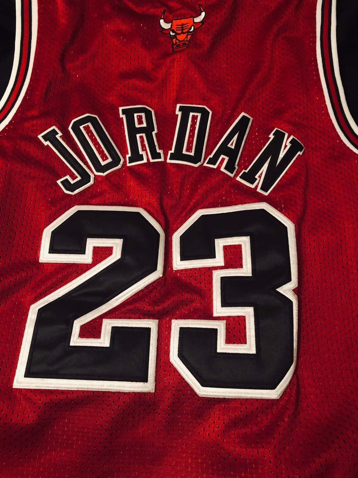 Celebrate Nba Legend Michael Jordan With This Classic Jersey. Wallpaper