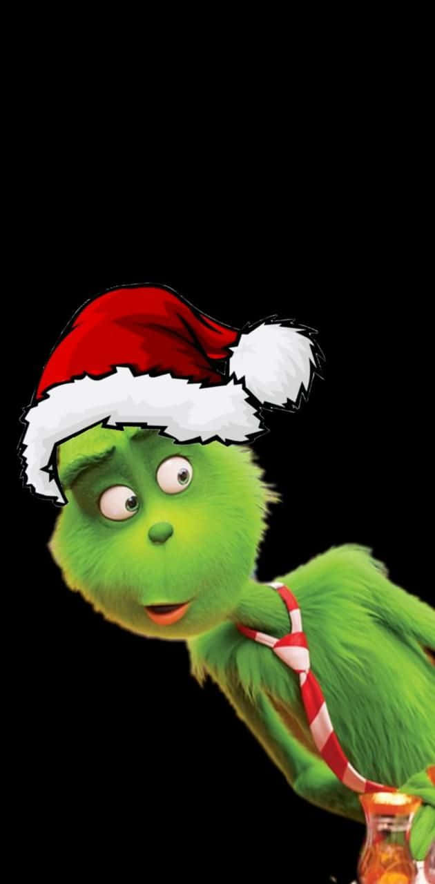 Celebrate The Holidays With A Cute Grinch Wallpaper