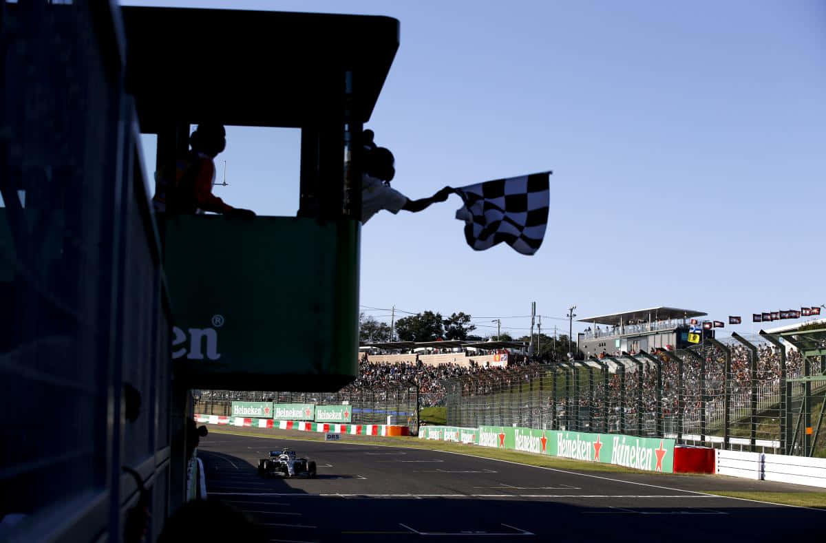 Chequered Flag On A Racing Track Wallpaper