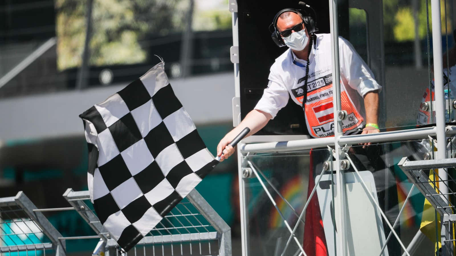 Chequered Flag Waving At Finish Line Wallpaper