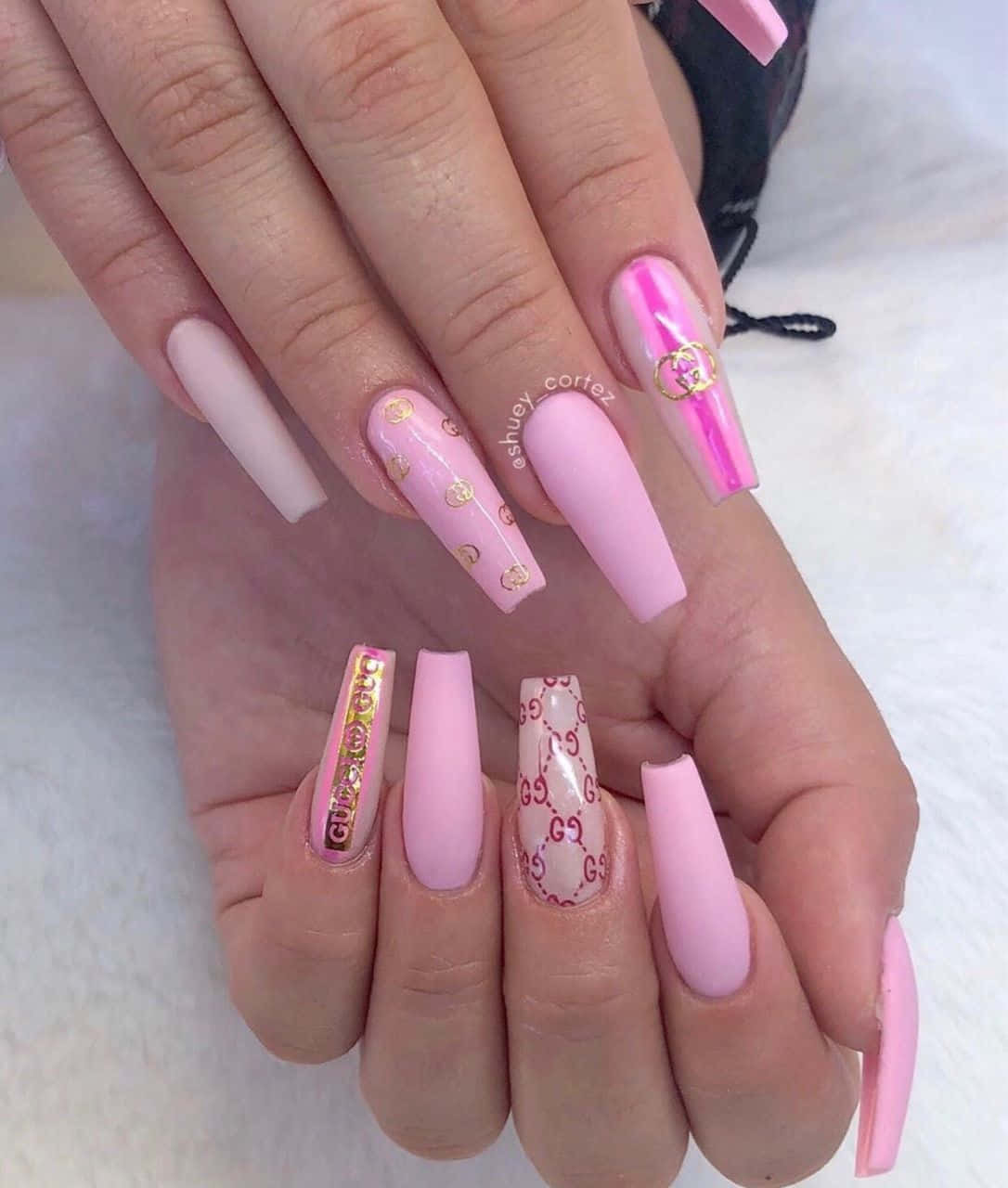 Chic Pink Nails On Granite Surface Wallpaper