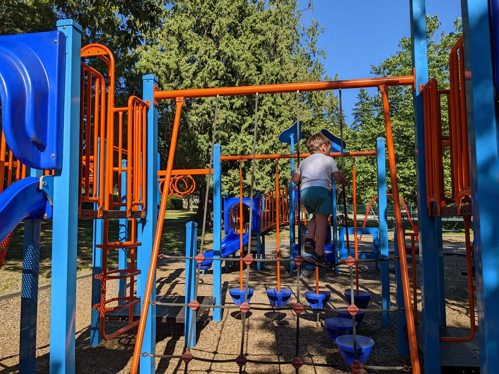 Child At Playground Burnaby Wallpaper