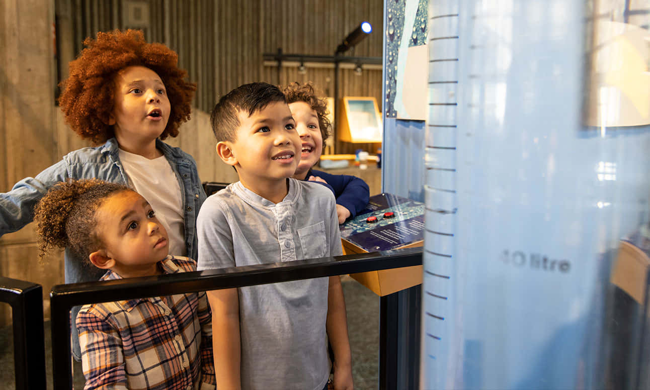 Children Engagedin Science Exhibit Wallpaper