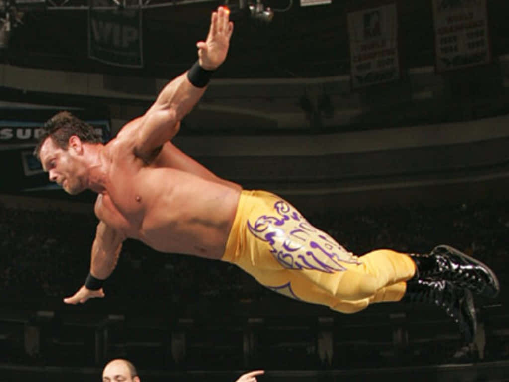 Chris Benoit Masterful Mid-air Leap Wallpaper