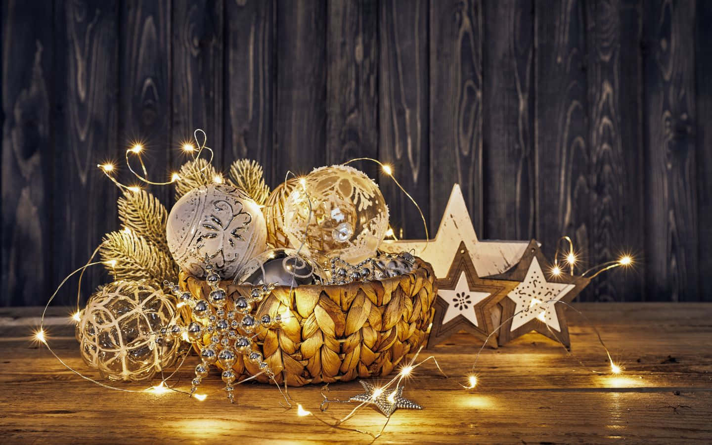 Christmas Decorations In A Bowl On A Wooden Table Wallpaper