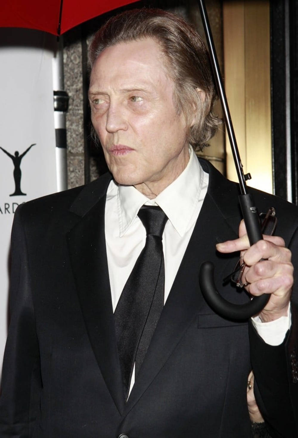 Christopher Walken Holding An Umbrella Wallpaper