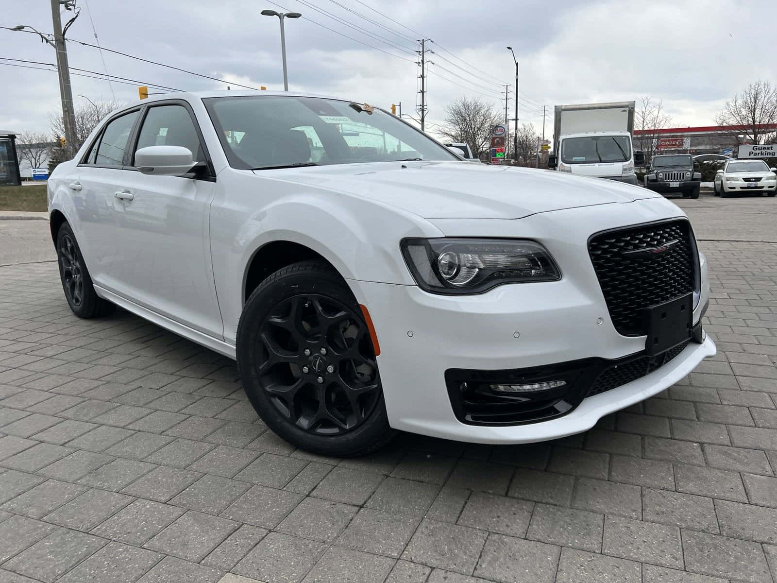 Chrysler 300 Luxury Sedan Parked On A City Street Wallpaper