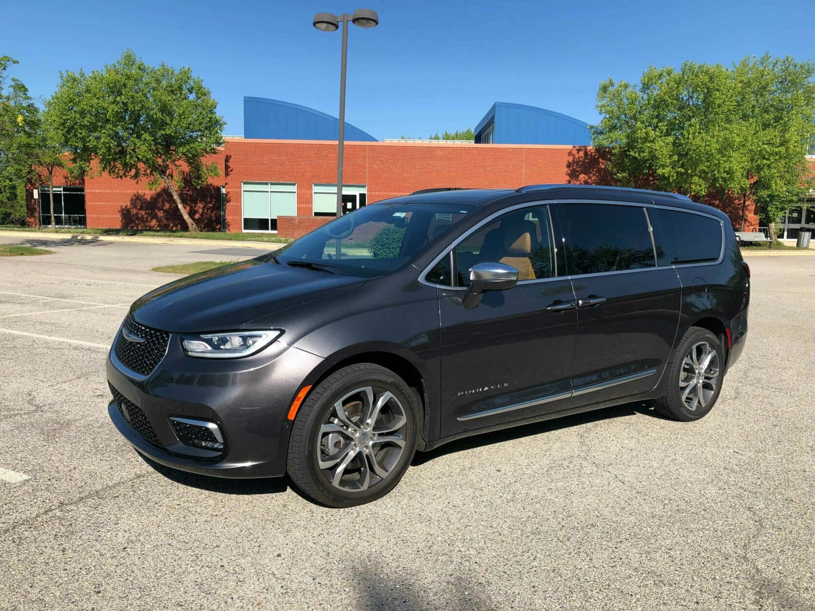 Chrysler Pacifica Driving On A Scenic Road Wallpaper