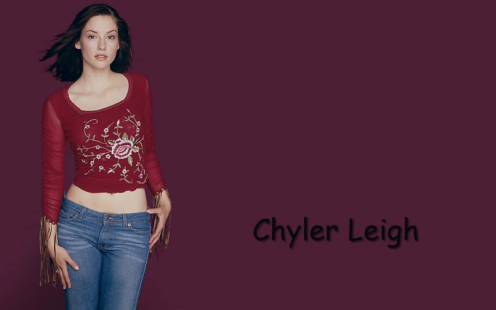 Chyler Leigh Smiling During A Photoshoot Wallpaper