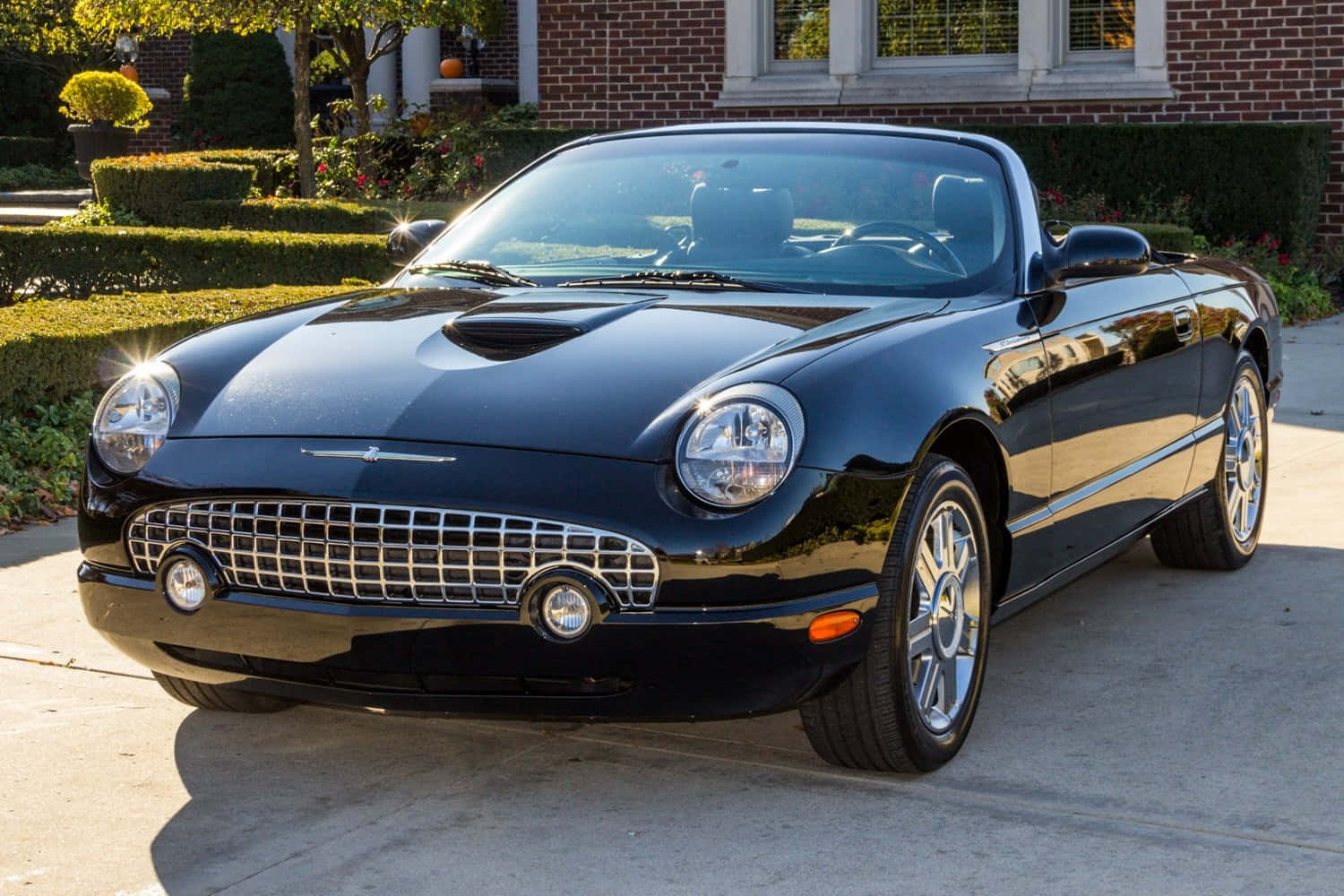 Classic Ford Thunderbird Cruising On An Open Road Wallpaper