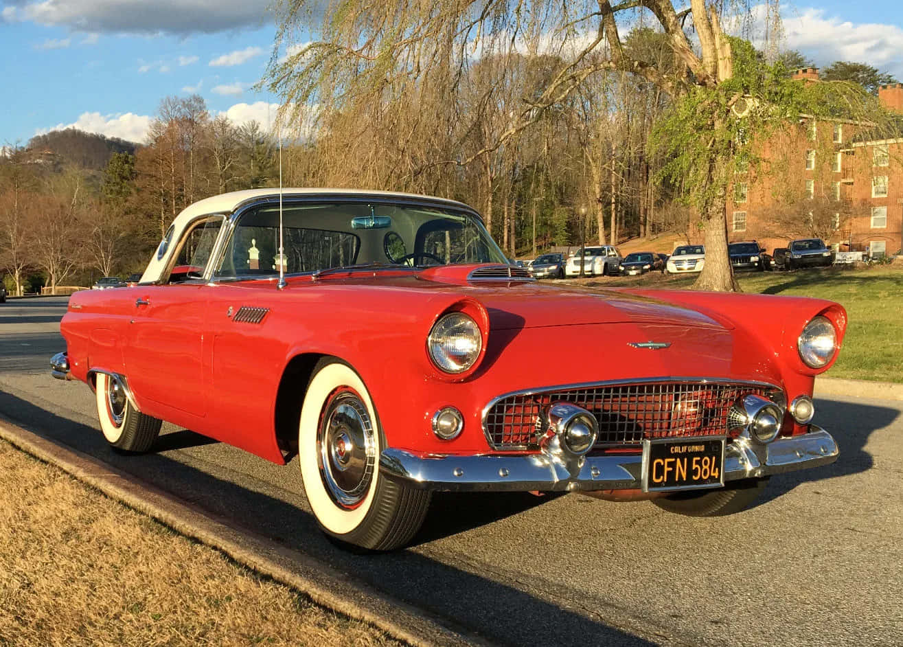 Classic Ford Thunderbird Parked On Roadside Wallpaper