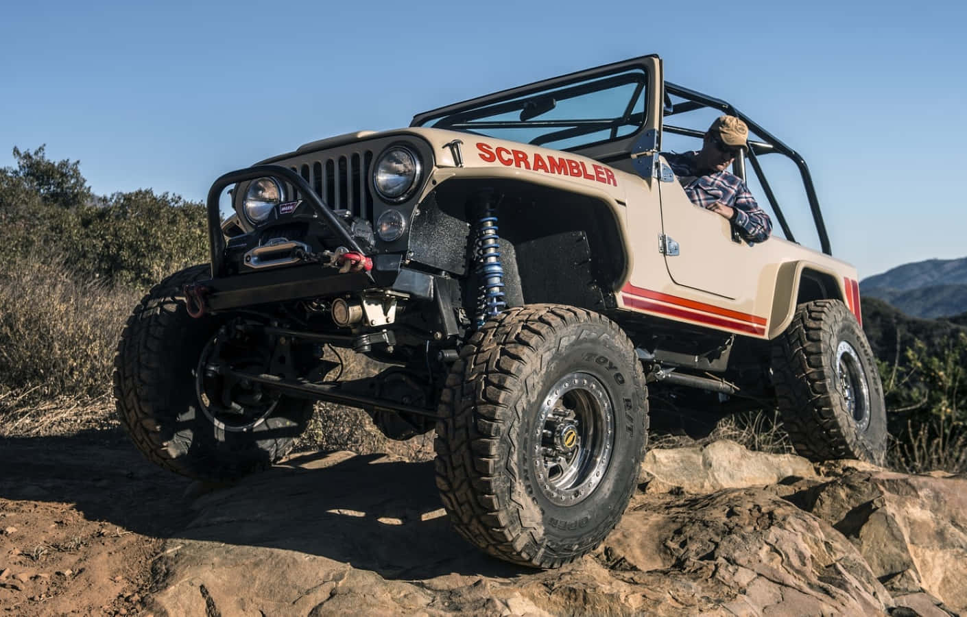 Classic Jeep Cj Conquering Off-road Terrain Wallpaper